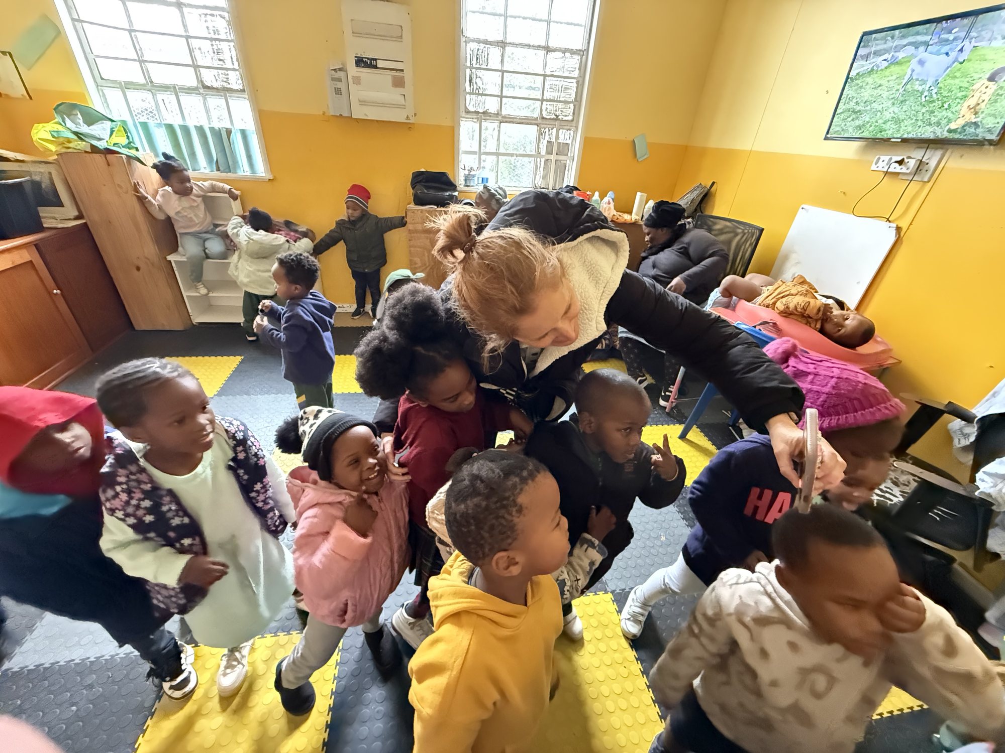 Mrs. Burton in a warm elementary classroom with young students